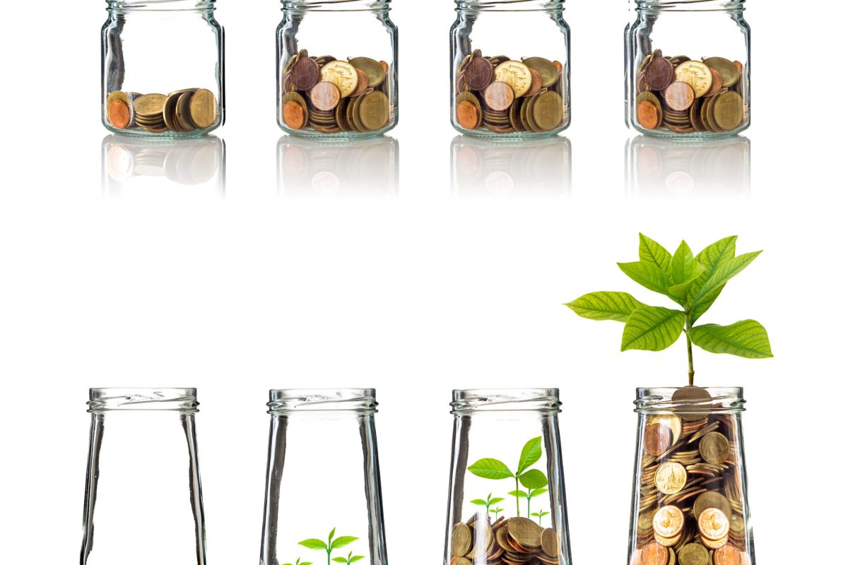 Gold coins and seed in clear bottle on white background,Business investment growth concept, active and passive income concept